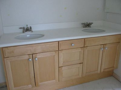 a bathroom countertop with two sinks
